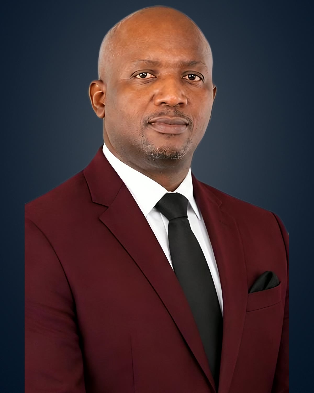 Apostle Marshall Lambert in a burgundy suit