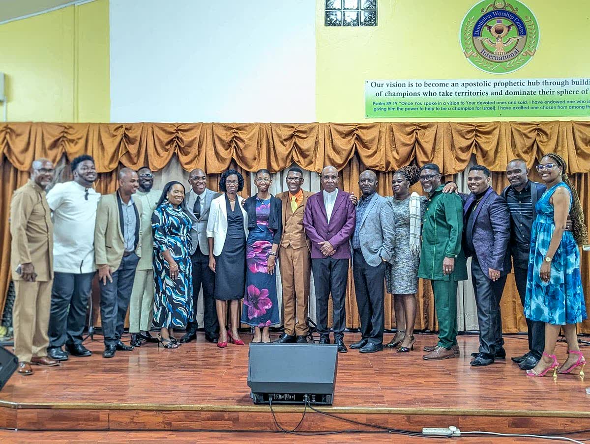 Apostle Lambert with church leaders on stage in Castries