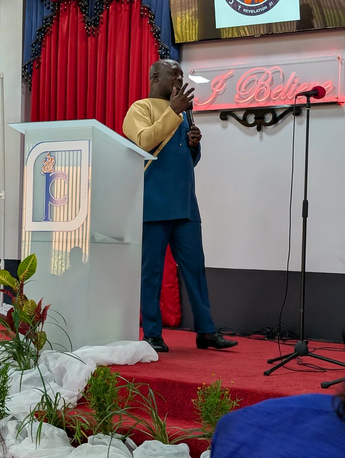 Apostle Lambert at the pulpit in Trinidad